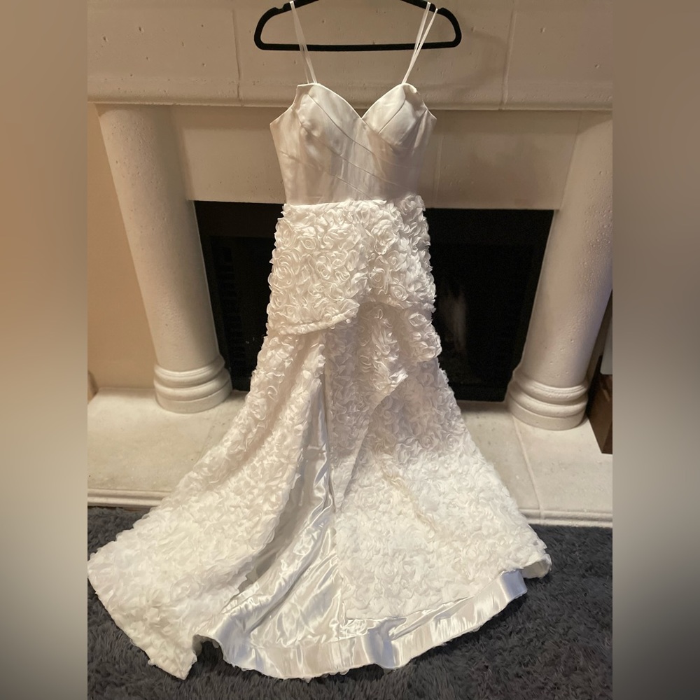 Wedding dress with floral appliqués